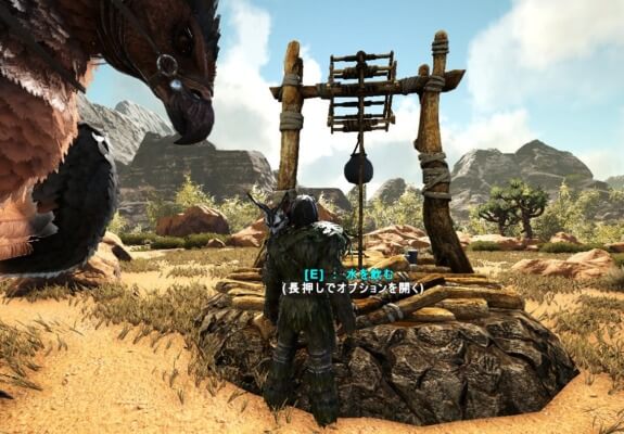 井戸の水を飲む